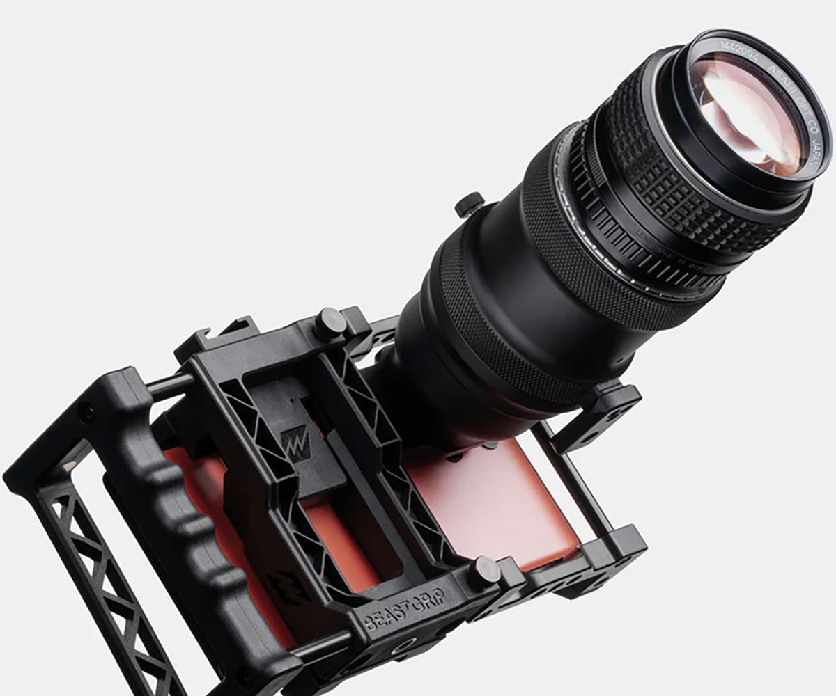 A BEASTGRIP Beastgrip DOF Adapter camera lens attached to an iphone